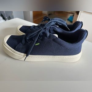 Navy/white cariuma shoes.  Vegan, featherweight, machine washable.  Bamboo knit.